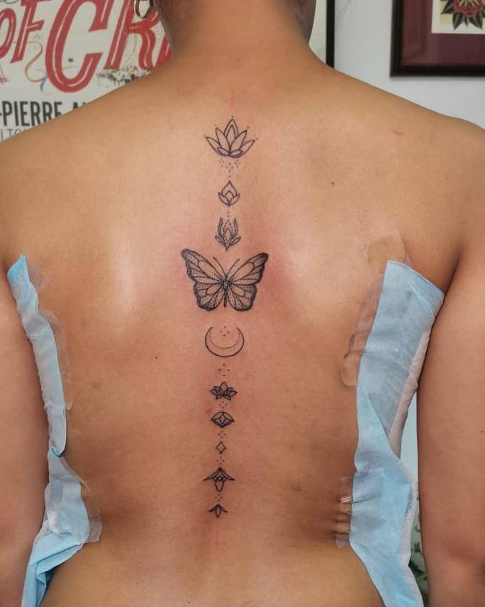 butterfly spine tattoos for women